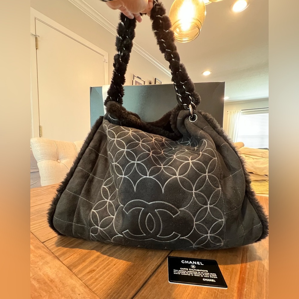 Authentic Chanel fur handbag, never carried. Perfect for fall/winter!
